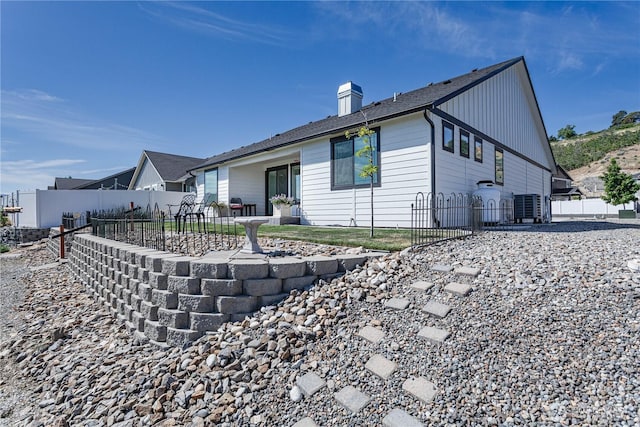 985 Spring Mountain Dr, Wenatchee, WA 98801 - view of property exterior with a chimney and a patio