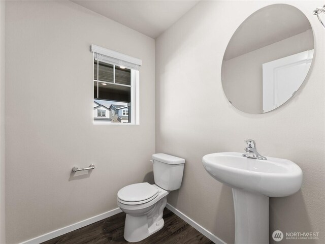 28305 74th Dr NW Unit 89, Stanwood, WA 98292 - half bath featuring toilet, wood finished floors, baseboards, and a sink