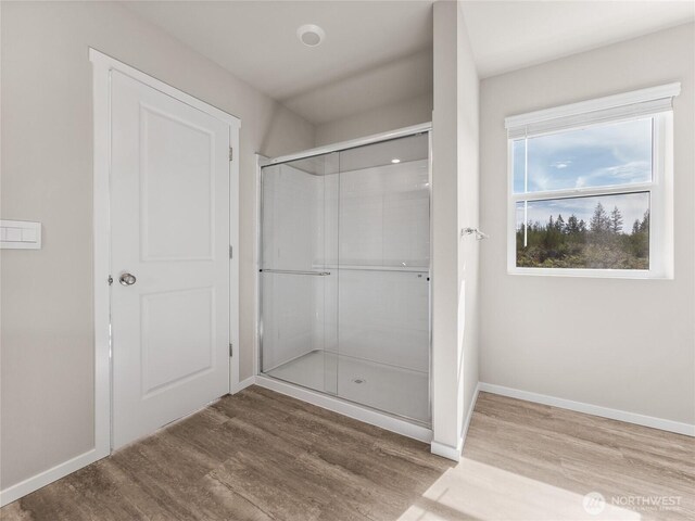 28305 74th Dr NW Unit 89, Stanwood, WA 98292 - bathroom featuring wood finished floors, an enclosed shower, and baseboards