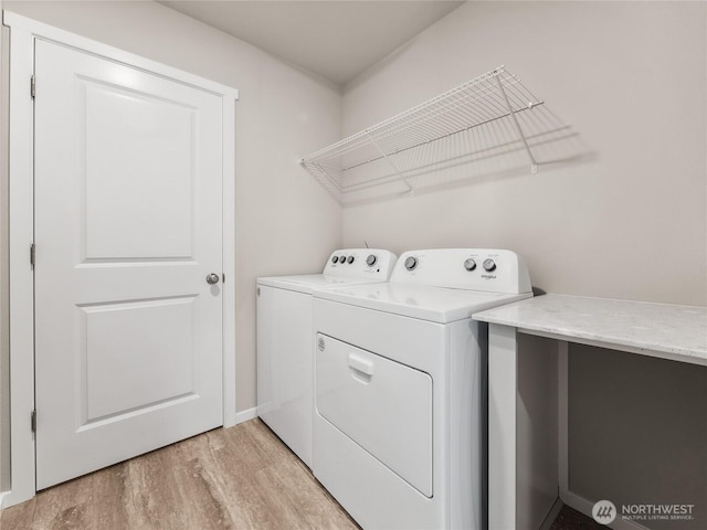 28305 74th Dr NW Unit 89, Stanwood, WA 98292 - laundry room featuring separate washer and dryer, light wood-style flooring, and baseboards