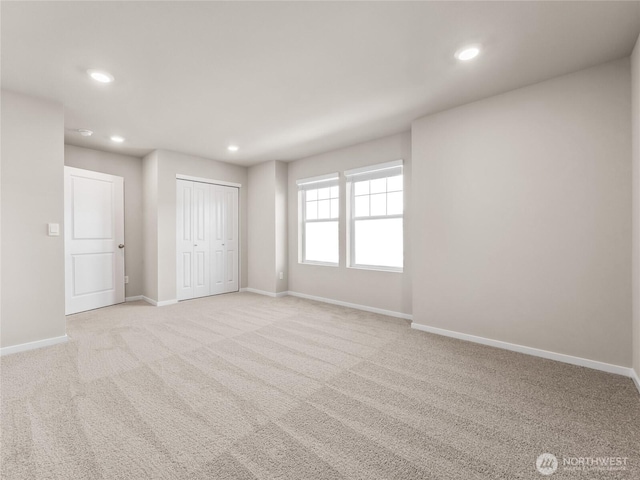 28305 74th Dr NW Unit 89, Stanwood, WA 98292 - unfurnished bedroom with recessed lighting, light colored carpet, baseboards, and a closet