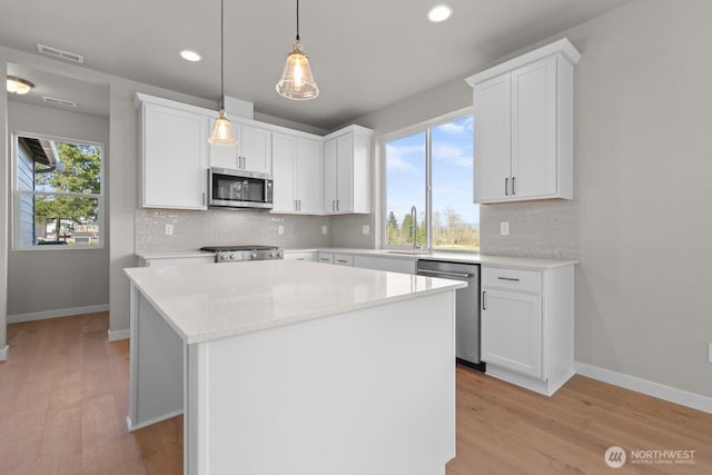 17705 11th Ave NE, Arlington, WA 98223 - kitchen with appliances with stainless steel finishes, recessed lighting, light wood finished floors, and backsplash
