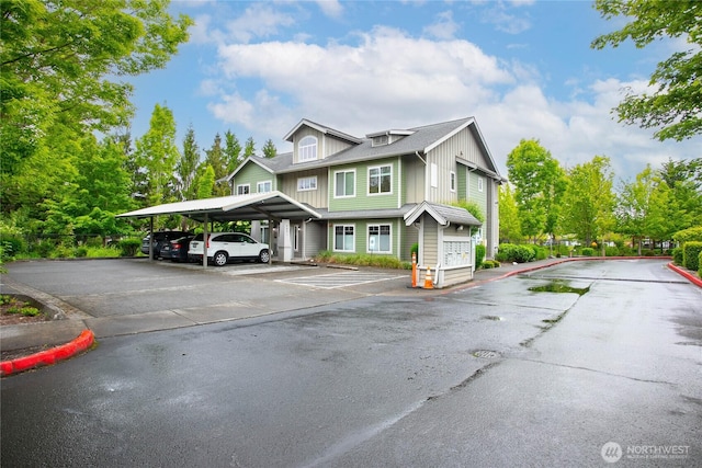 4631 Quinn Ct Unit 101, Bellingham, WA 98226 - view of property featuring board and batten siding and covered and uncovered parking