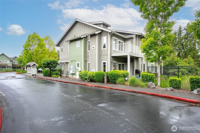 4631 Quinn Ct Unit 101, Bellingham, WA 98226 - view of property exterior featuring board and batten siding, fence, and a balcony