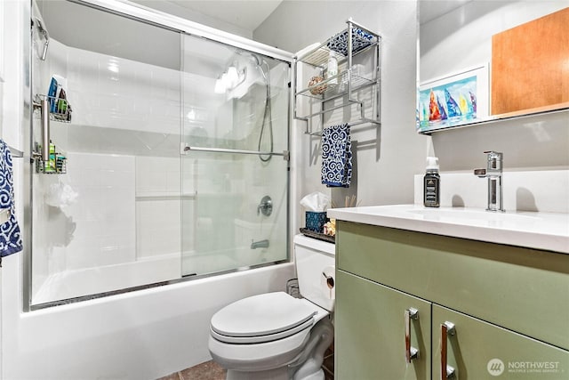4631 Quinn Ct Unit 101, Bellingham, WA 98226 - bathroom featuring vanity, toilet, and bath / shower combo with glass door
