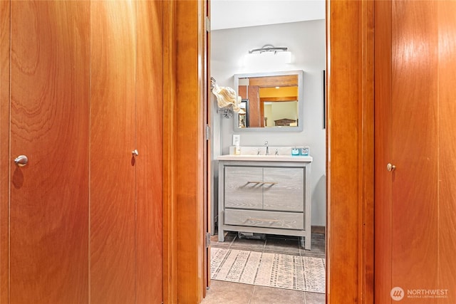 4631 Quinn Ct Unit 101, Bellingham, WA 98226 - bathroom featuring vanity, tile patterned flooring, and a closet