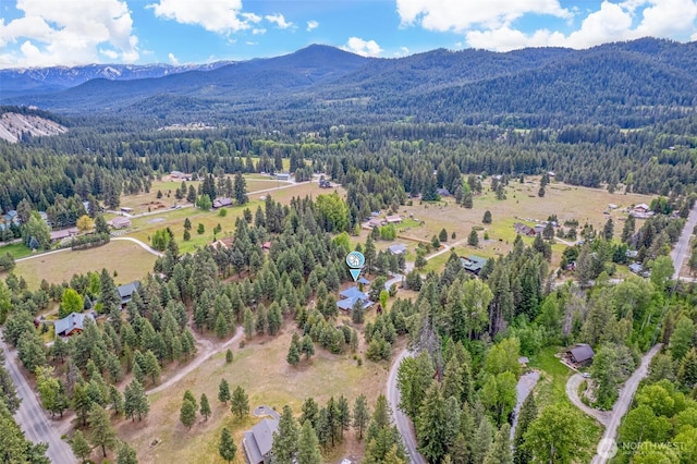 12111 W Shugart Flats Rd, Leavenworth, WA 98826 - drone / aerial view of a heavily wooded area and mountains