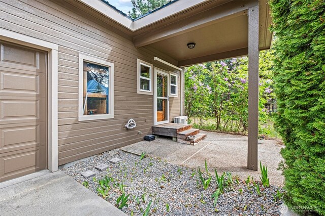 12111 W Shugart Flats Rd, Leavenworth, WA 98826 - view of patio / terrace with a garage