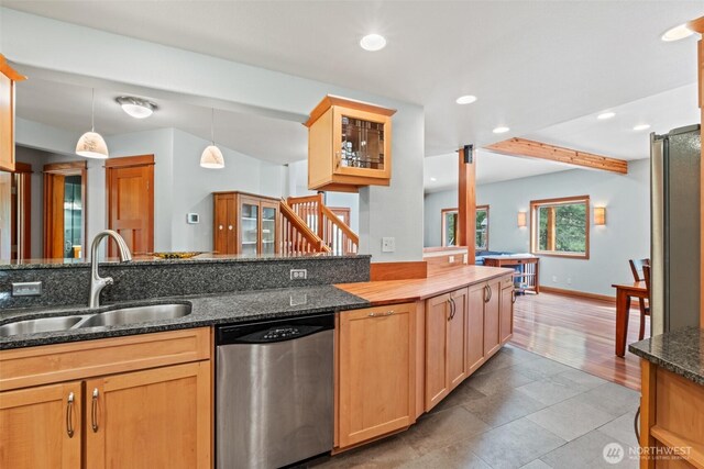 12111 W Shugart Flats Rd, Leavenworth, WA 98826 - kitchen featuring stainless steel dishwasher, a sink, recessed lighting, glass insert cabinets, and pendant lighting