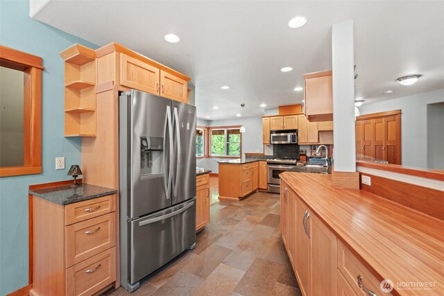 12111 W Shugart Flats Rd, Leavenworth, WA 98826 - kitchen with appliances with stainless steel finishes, light brown cabinetry, backsplash, recessed lighting, and open shelves
