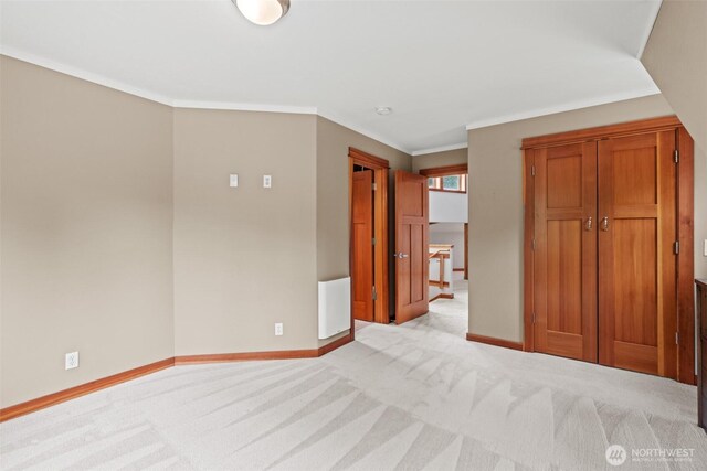 12111 W Shugart Flats Rd, Leavenworth, WA 98826 - unfurnished bedroom featuring light carpet, baseboards, and crown molding