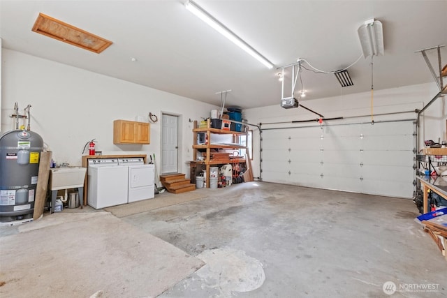 12111 W Shugart Flats Rd, Leavenworth, WA 98826 - garage with independent washer and dryer, a sink, electric water heater, and a garage door opener