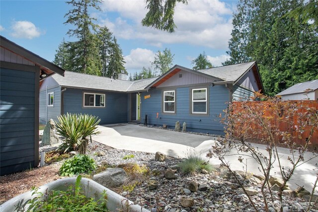 839 St Andrews Way, Bellingham, WA 98229 - back of property with a patio, concrete driveway, and roof with shingles