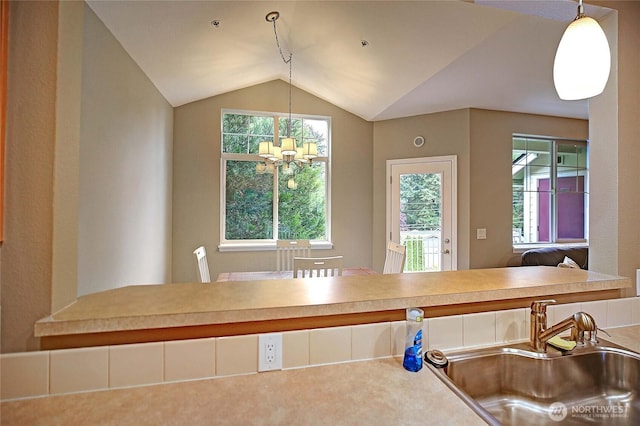 13000 Admiralty Way Unit A305, Everett, WA 98204 - kitchen with a sink, a chandelier, vaulted ceiling, and decorative light fixtures