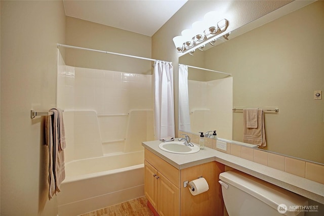 13000 Admiralty Way Unit A305, Everett, WA 98204 - bathroom featuring toilet, shower / bath combo, vanity, and wood finished floors