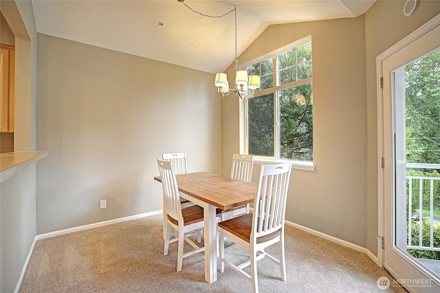 13000 Admiralty Way Unit A305, Everett, WA 98204 - dining area with healthy amount of natural light, a chandelier, light carpet, and lofted ceiling