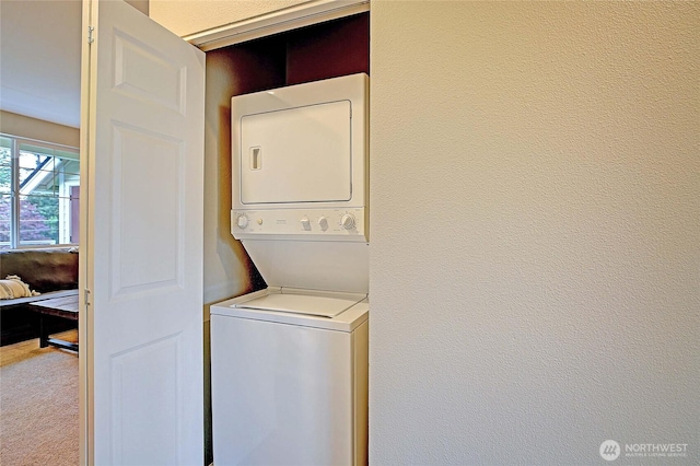 13000 Admiralty Way Unit A305, Everett, WA 98204 - laundry room with stacked washer and clothes dryer and carpet floors