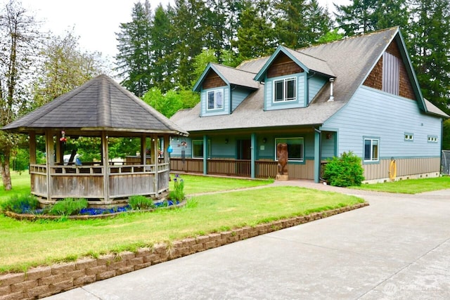 view of front of home featuring a gazebo, a front lawn, covered porch, and roof with shingles