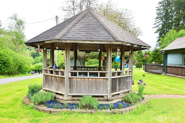 exterior space with a gazebo and a lawn