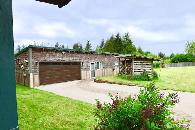 view of front of property featuring an attached garage and driveway