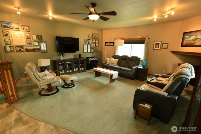 living room featuring rail lighting and a ceiling fan