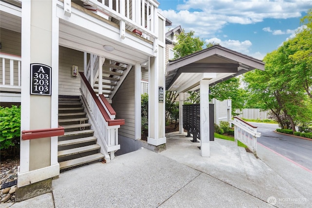 18505 SE Newport Way Unit A203, Issaquah, WA 98027 - view of patio / terrace featuring mail area and stairway