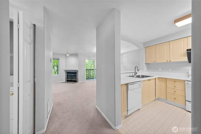 18505 SE Newport Way Unit A203, Issaquah, WA 98027 - kitchen featuring white dishwasher, a sink, cream cabinets, and light countertops
