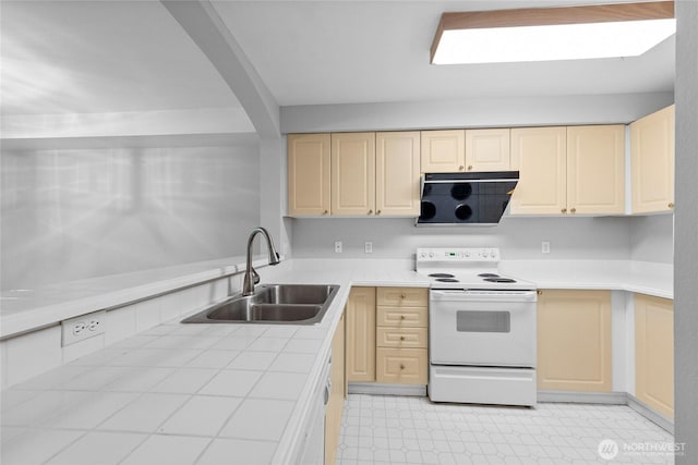 18505 SE Newport Way Unit A203, Issaquah, WA 98027 - kitchen featuring electric stove, a sink, tile counters, and light brown cabinets