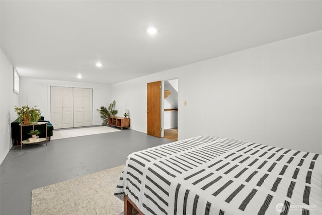 270 Puget Loop, Port Ludlow, WA 98365 - bedroom with finished concrete floors, a closet, and recessed lighting