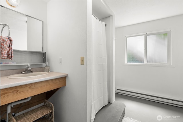 270 Puget Loop, Port Ludlow, WA 98365 - bathroom with a baseboard heating unit and vanity