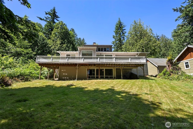 270 Puget Loop, Port Ludlow, WA 98365 - back of property with a deck, a lawn, and a chimney