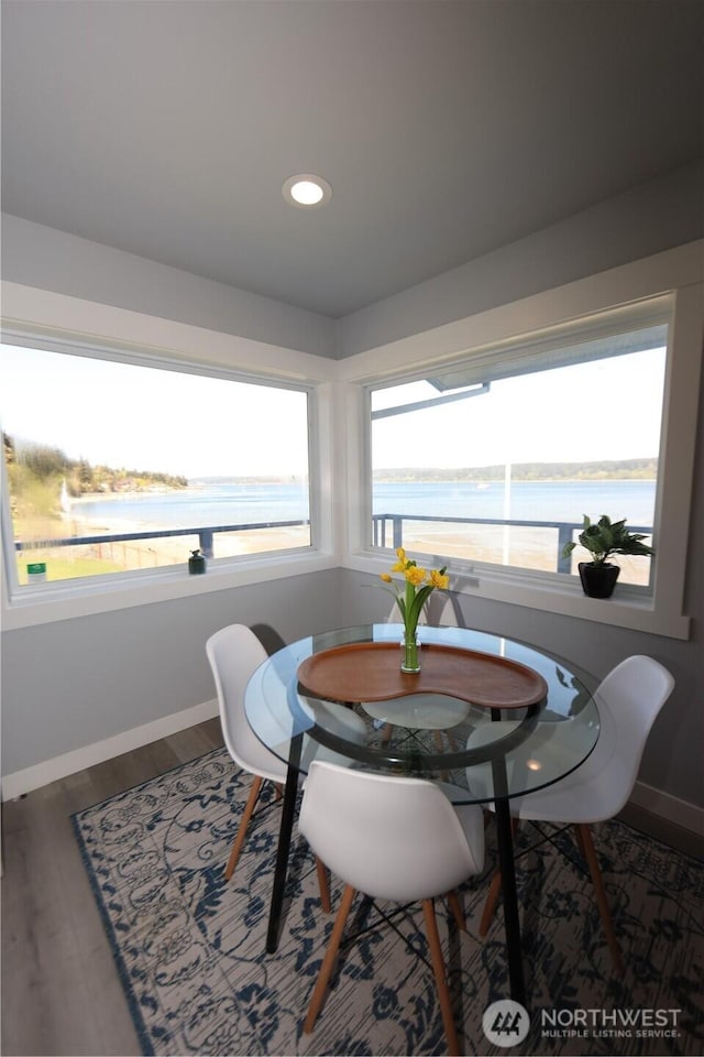 5341 S Bercot Rd, Freeland, WA 98249 - dining room with baseboards, a water view, wood finished floors, and recessed lighting