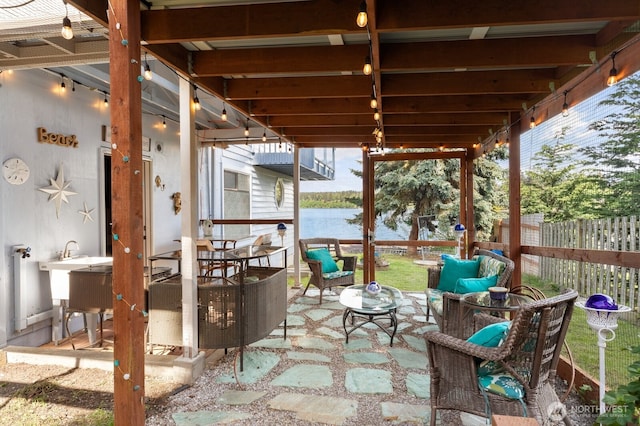 5341 S Bercot Rd, Freeland, WA 98249 - view of patio / terrace with a water view, a fenced backyard, and an outdoor hangout area