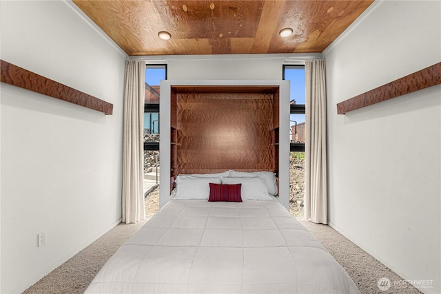 23692 NW Cliffe Pointe Rd Unit 6C, Quincy, WA 98848 - unfurnished bedroom with carpet, wood ceiling, multiple windows, and access to outside
