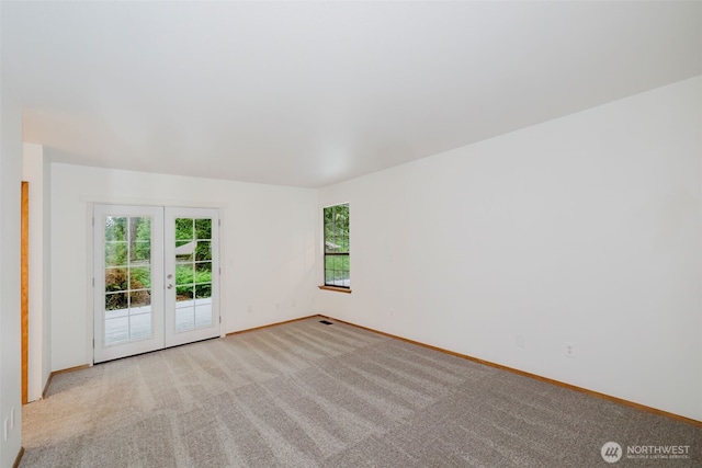 4112 114th Street Ct NW, Gig Harbor, WA 98332 - unfurnished room with french doors, healthy amount of natural light, baseboards, and carpet flooring