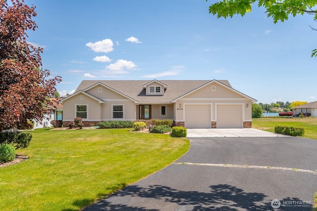 8306ROAD 3.2 NE, Moses Lake, WA 98837 - view of front of home featuring stone siding, driveway, an attached garage, and a front yard