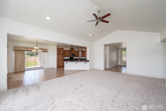 8306ROAD 3.2 NE, Moses Lake, WA 98837 - unfurnished living room featuring a chandelier, light carpet, healthy amount of natural light, a ceiling fan, and recessed lighting