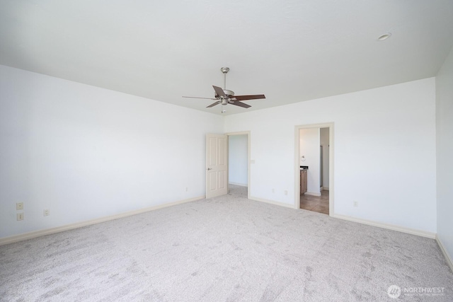 8306ROAD 3.2 NE, Moses Lake, WA 98837 - unfurnished bedroom with light colored carpet, baseboards, ceiling fan, and connected bathroom