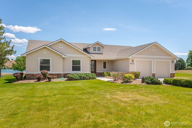 8306ROAD 3.2 NE, Moses Lake, WA 98837 - view of front of home with stone siding, a garage, and a front yard