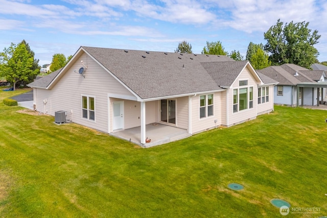 8306ROAD 3.2 NE, Moses Lake, WA 98837 - rear view of house with a patio, a shingled roof, central AC unit, and a yard