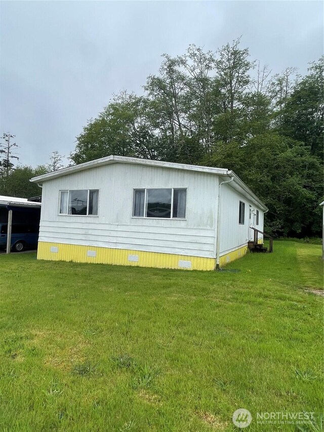 1050 Howard St Unit 10, Raymond, WA 98577 - view of side of property with crawl space and a yard