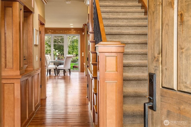 stairs with hardwood / wood-style flooring