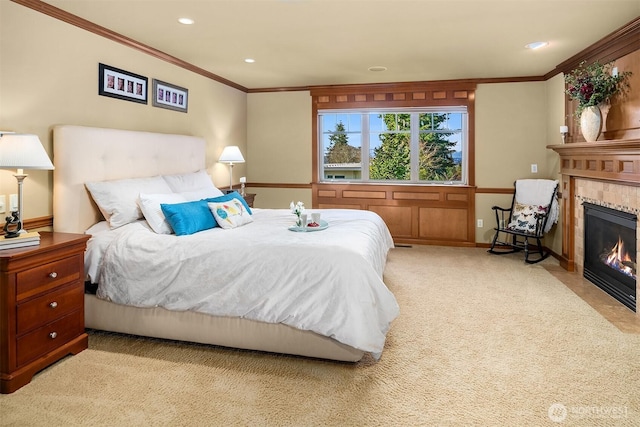 bedroom featuring crown molding, light colored carpet, a fireplace, recessed lighting, and baseboards