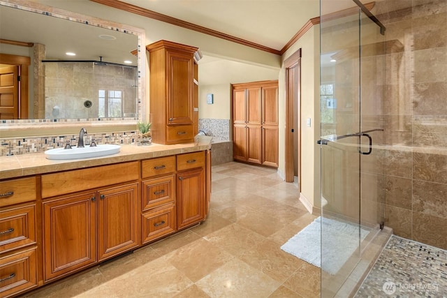 full bath with ornamental molding, a stall shower, and vanity