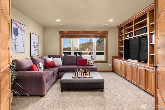 living area featuring light carpet, recessed lighting, and baseboards