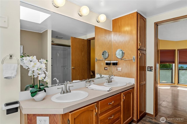 2610 E Section St Unit 115, Mount Vernon, WA 98274 - bathroom with a skylight, double vanity, and wood finished floors