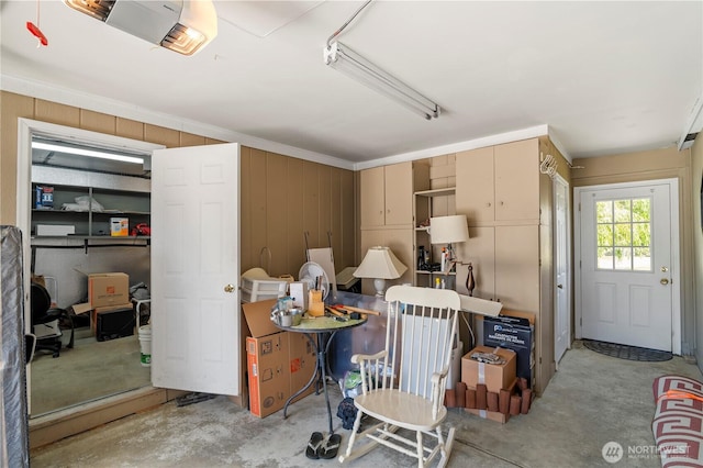 2610 E Section St Unit 115, Mount Vernon, WA 98274 - garage with a garage door opener and wood walls