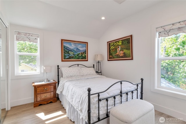 1415 29th Ave Unit C, Seattle, WA 98122 - bedroom with multiple windows, light wood-style floors, lofted ceiling, baseboards, and recessed lighting