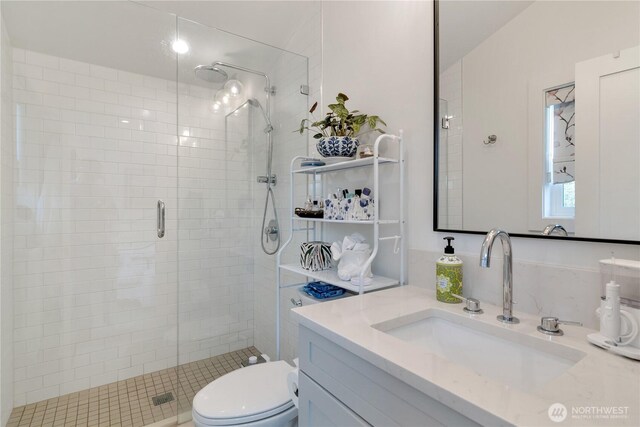 1415 29th Ave Unit C, Seattle, WA 98122 - bathroom featuring a shower stall, vanity, and toilet