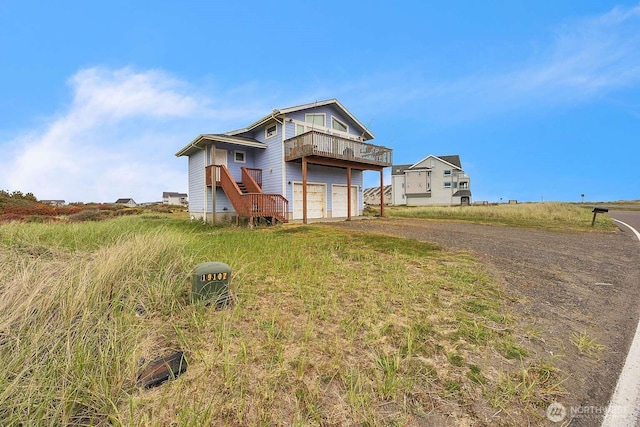 1488 Ocean Shores Blvd SW, Ocean Shores, WA 98569 - view of front of property with driveway and an attached garage